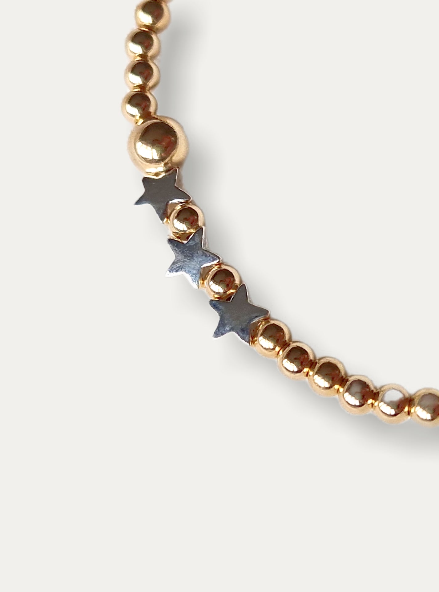 Gold Bobble Bracelet - Silver Star Beads